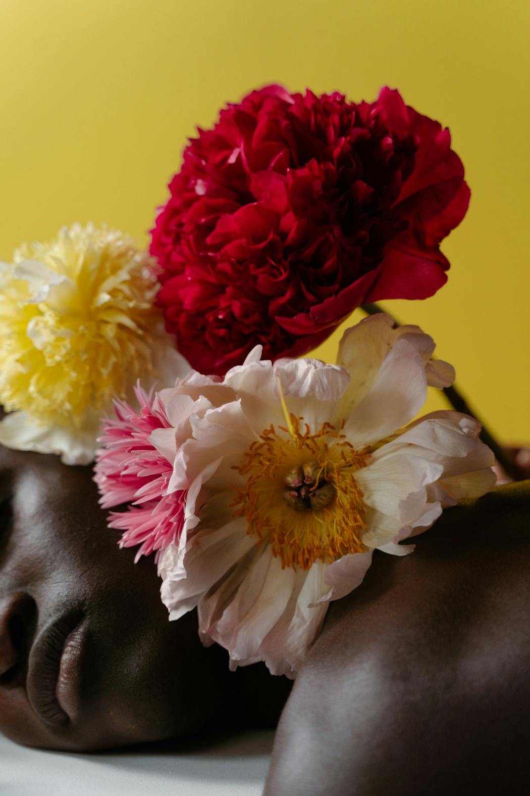 Flowers on a man lying down