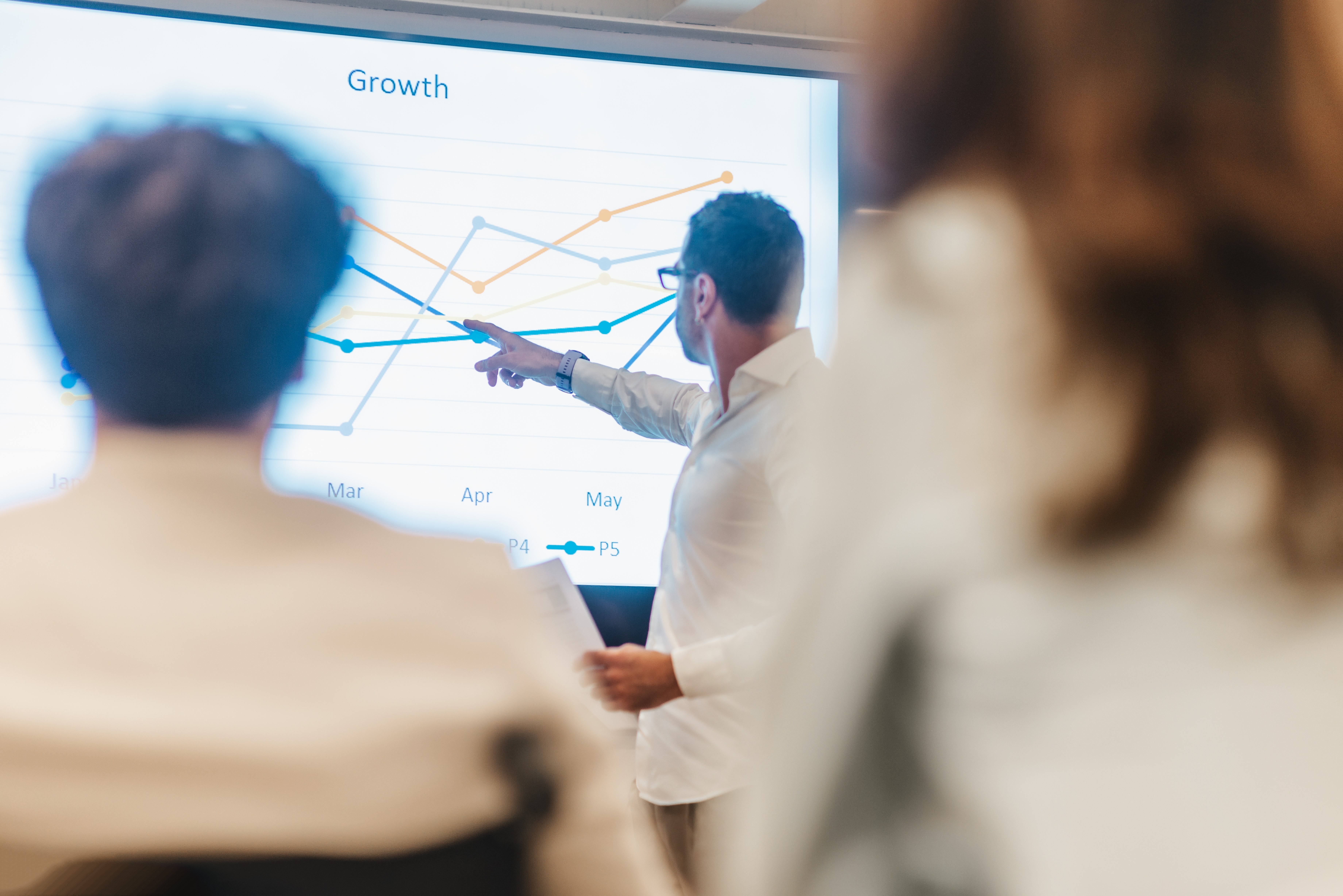 person writing on a piece of paper 