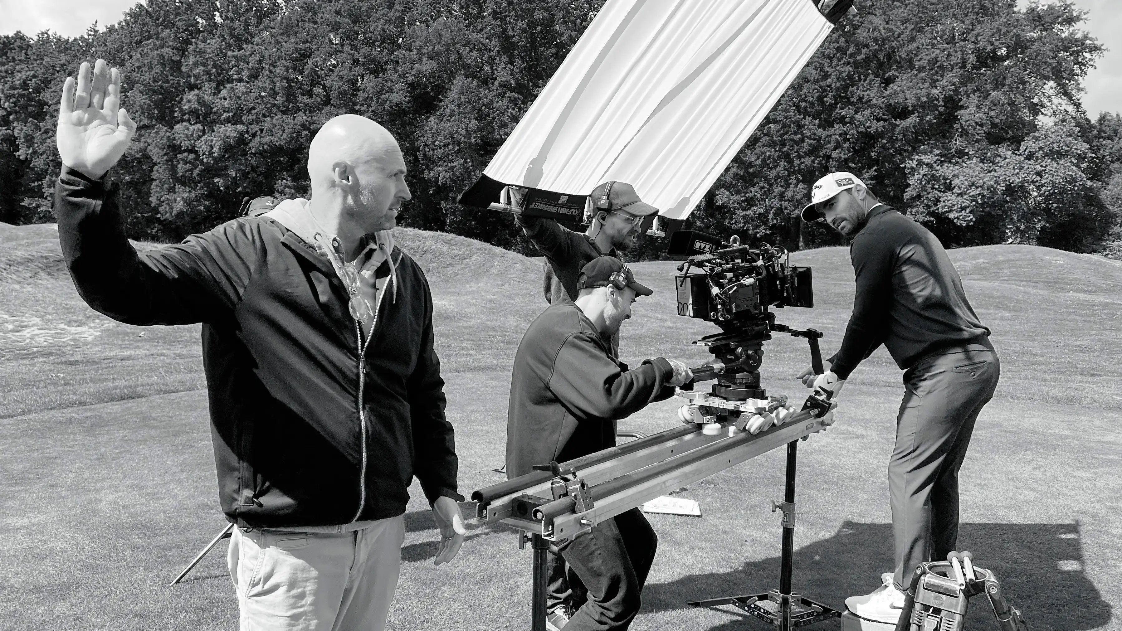 Alan Cloniet beside a camera on set