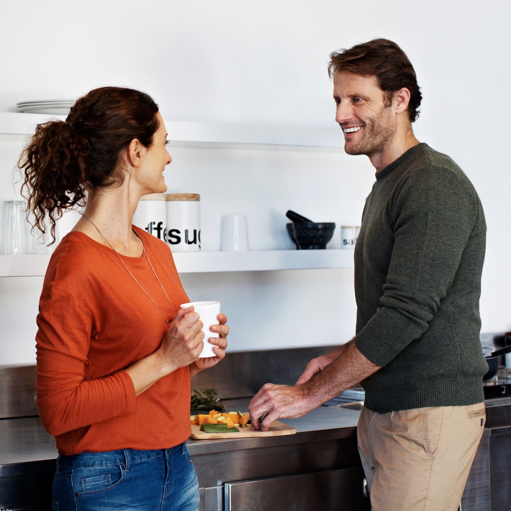 Couple talking in the kitchen