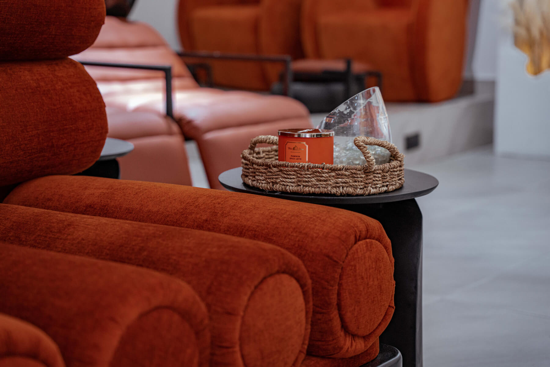 a living room with a tv and chairs