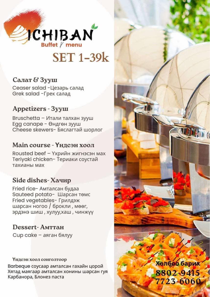 Aerial view of a winding road cutting through rocky terrain and sandy landscape.