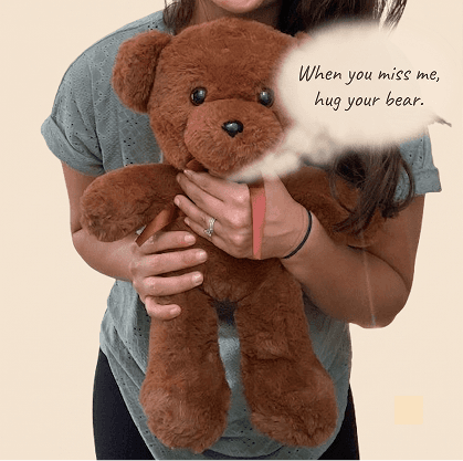 Bear held close, with a message bubble
