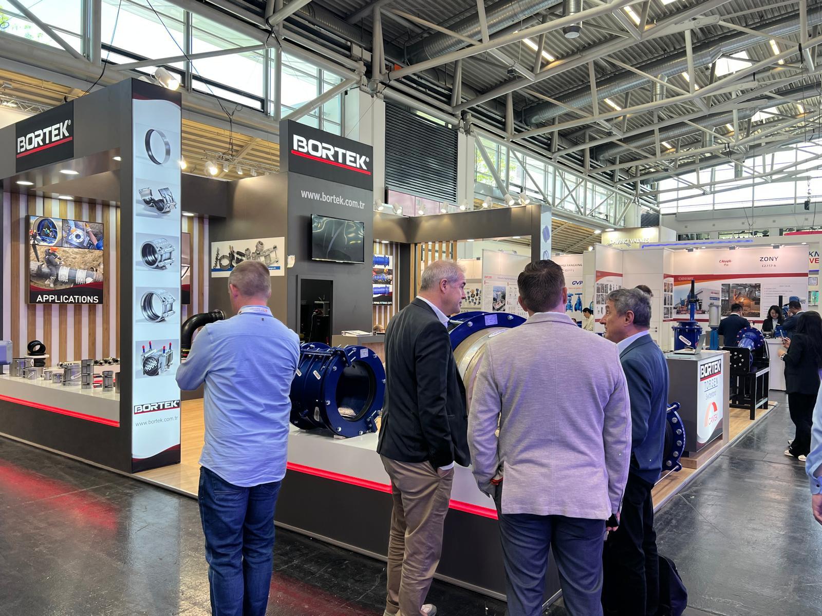Alternate view of the Bortek stand showing the layout and product positioning.