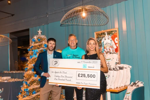 Sport in Mind group photo with Graham and the cheque