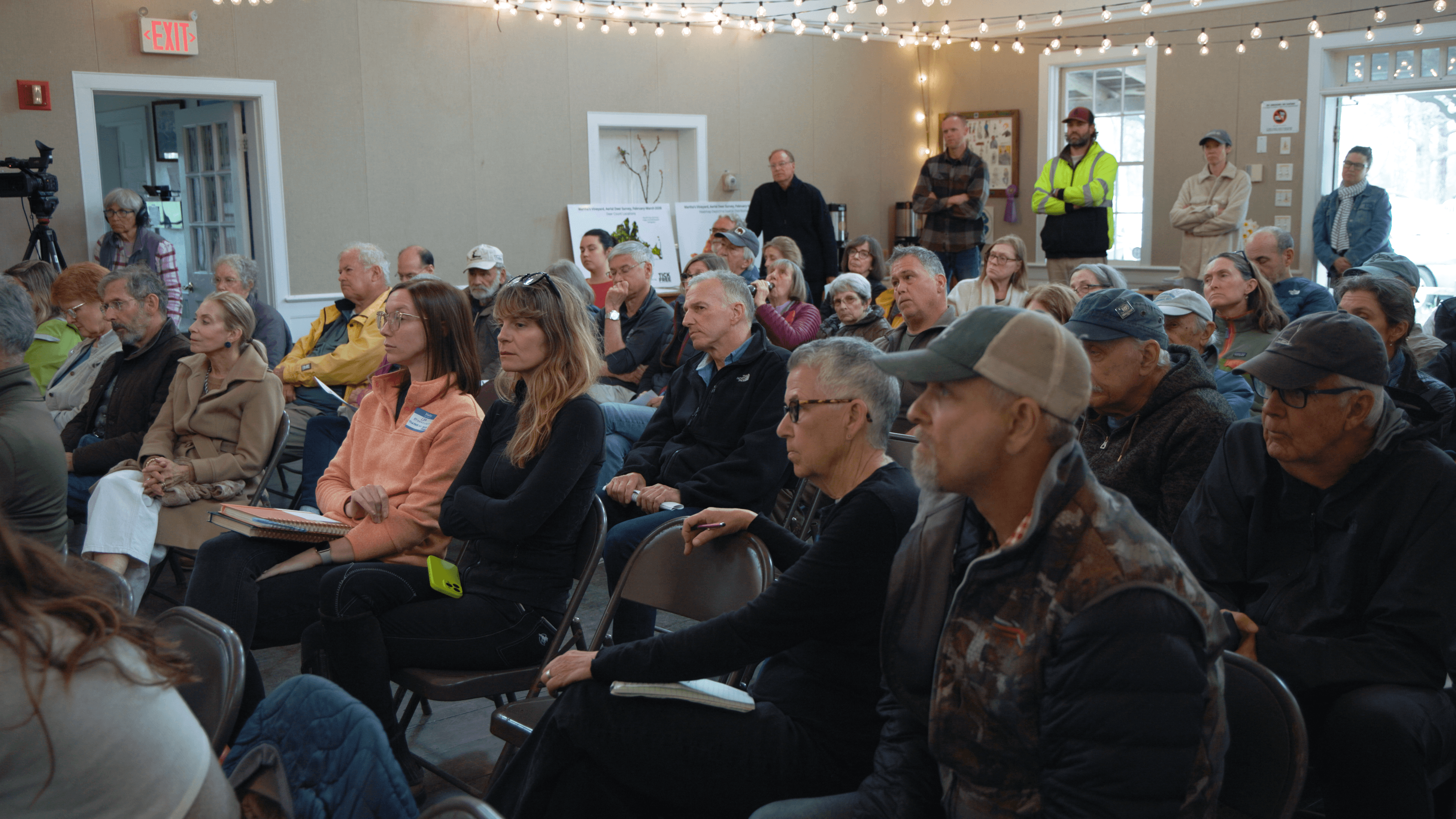 Community members gathered in an assembly hall
