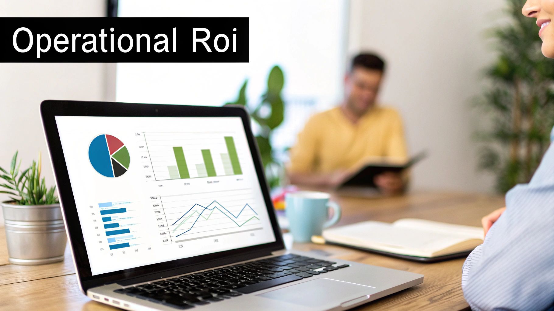 Laptop displaying operational ROI charts and graphs in a modern office setting.