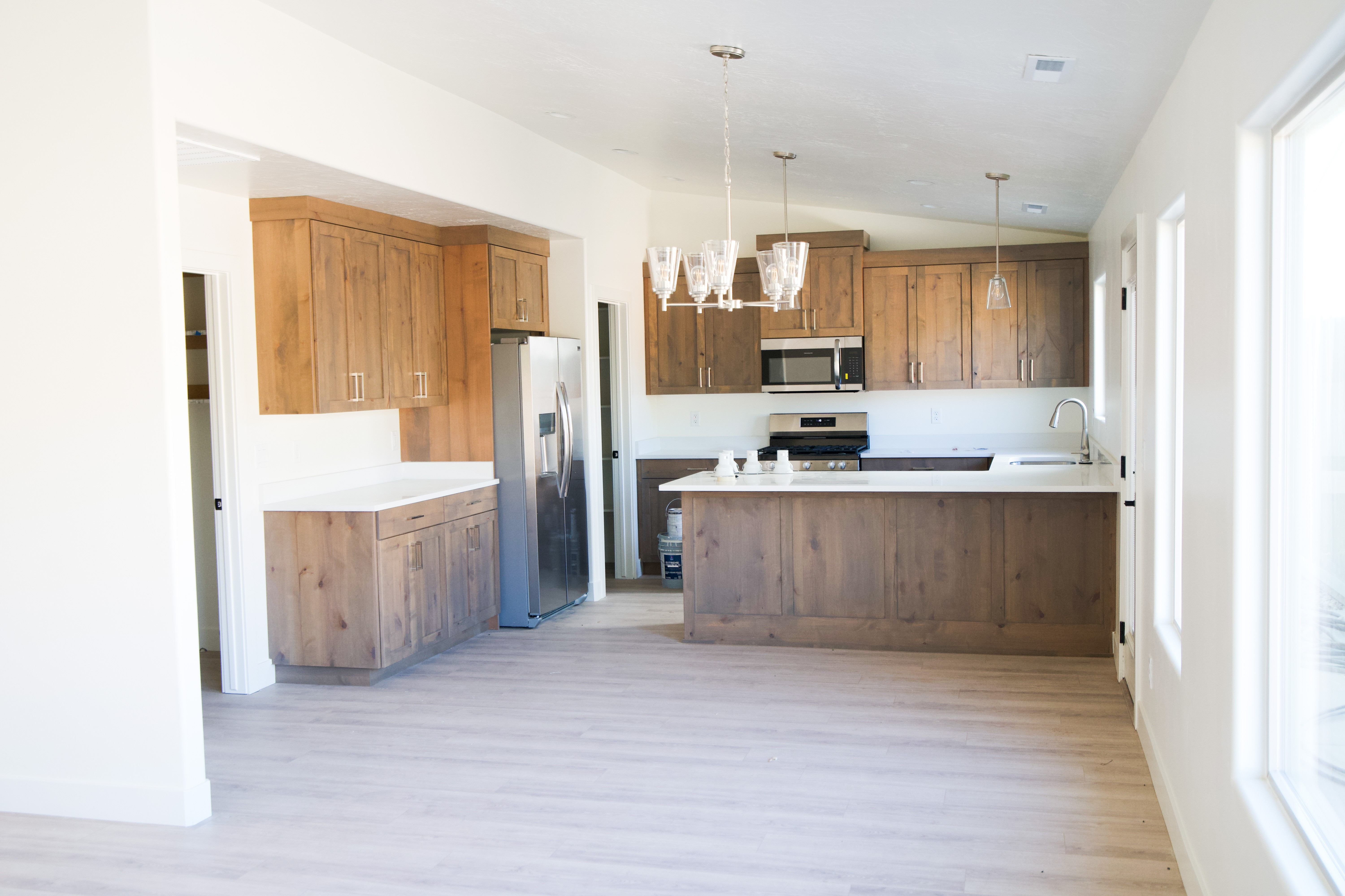 Kitchen in a Hurricane, Utah remodel with warm wood cabinetry and modern finishes.
