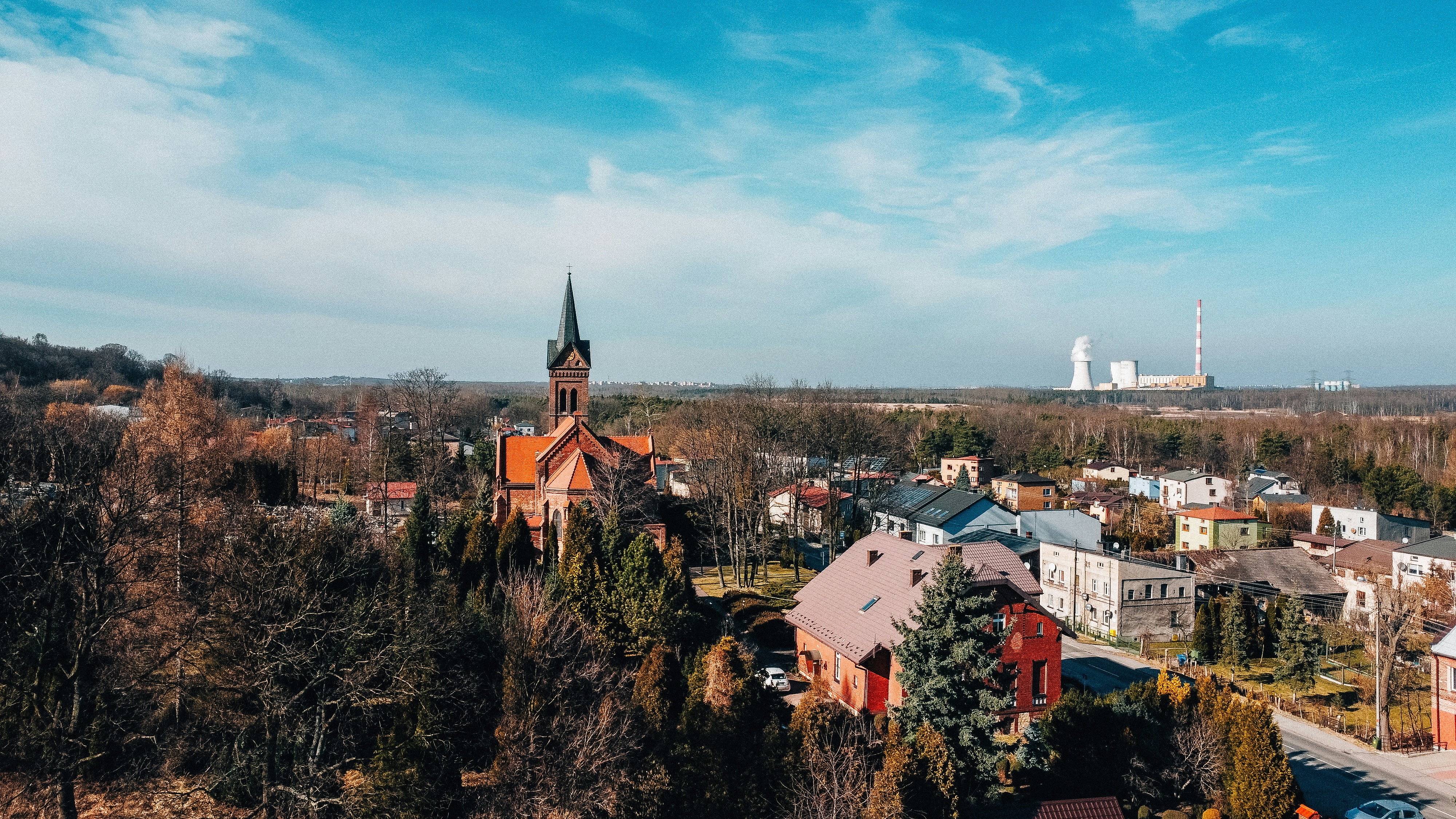 An aerial view of a small town with a church
