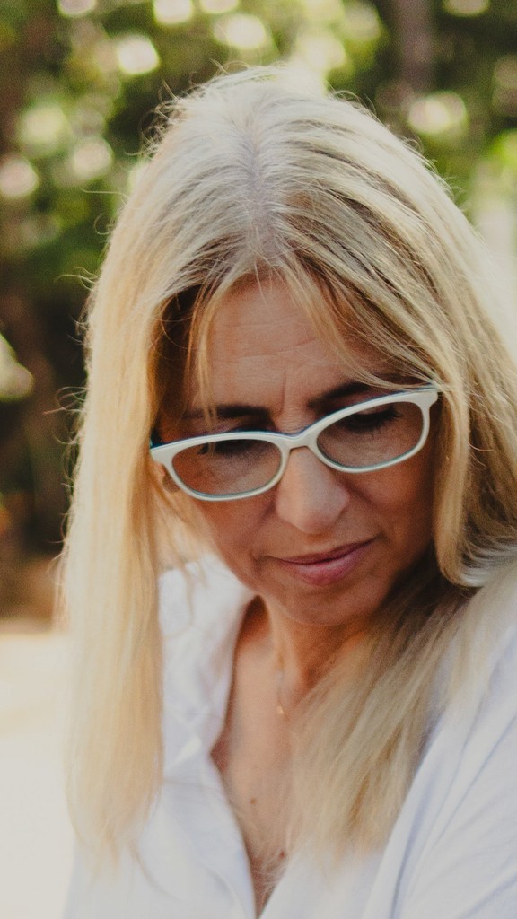 Two people stretching on yoga mats