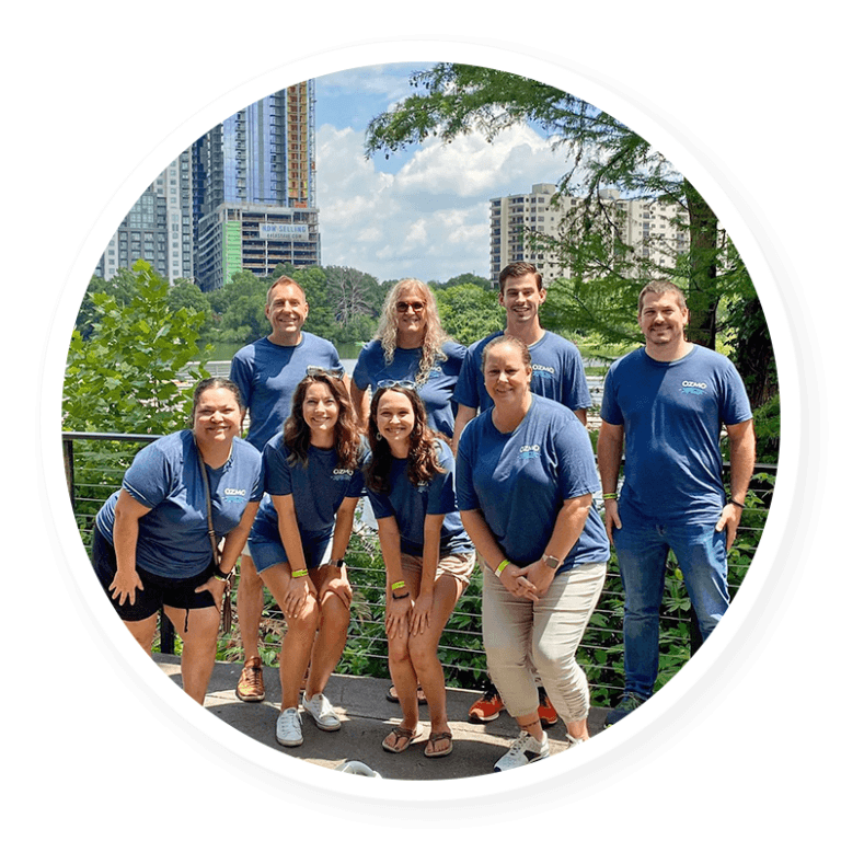 Ozmonauts posing in front of trees and a city scape