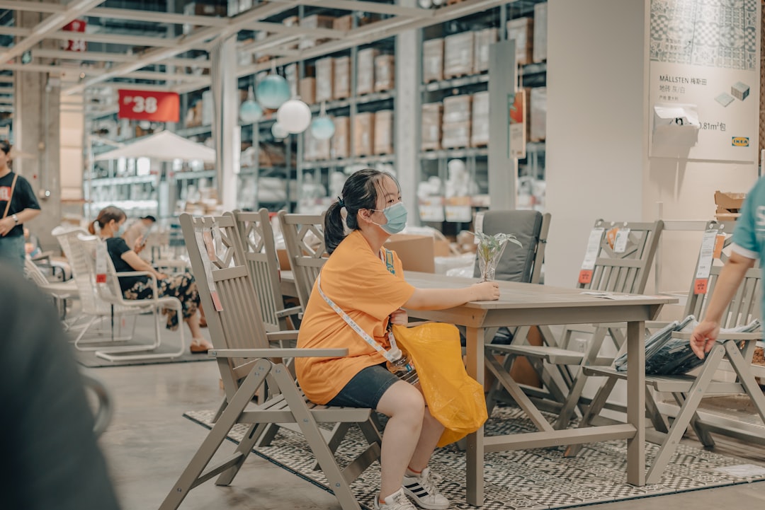 woman in orange dress sitting on chair