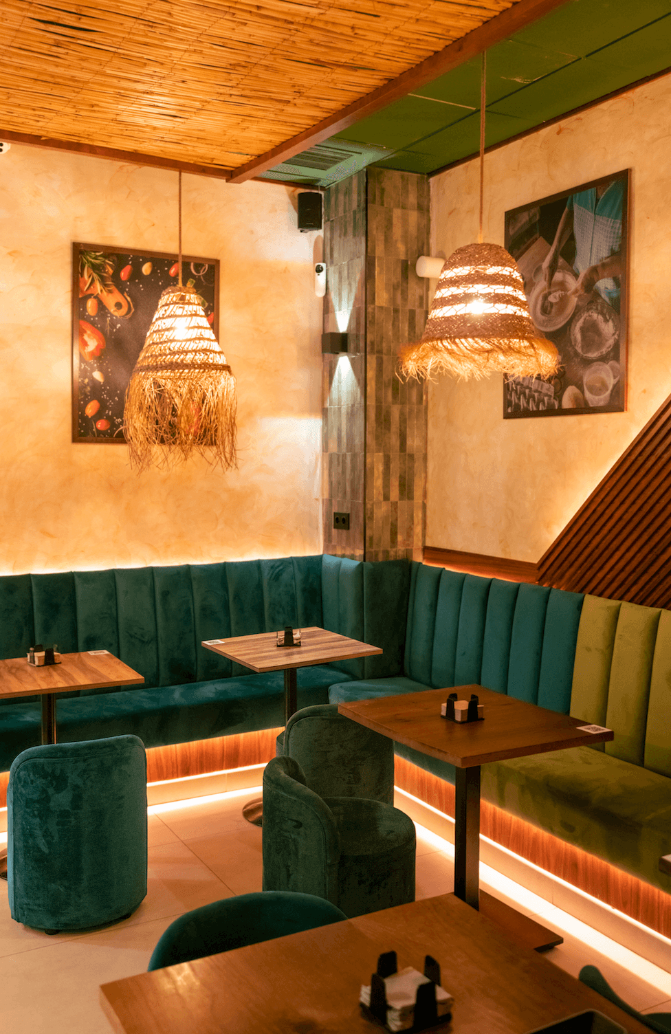 A luxurious indoor pool area with a panoramic view of a city at sunset. Comfortable lounge beds with soft fabrics surround the pool, while warm ambient lighting enhances the sophisticated atmosphere. The space combines modern elegance with a tranquil vibe.