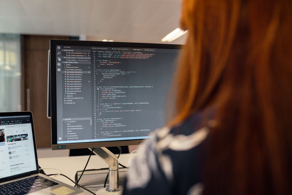 Web developer optimizing code and analyzing performance metrics