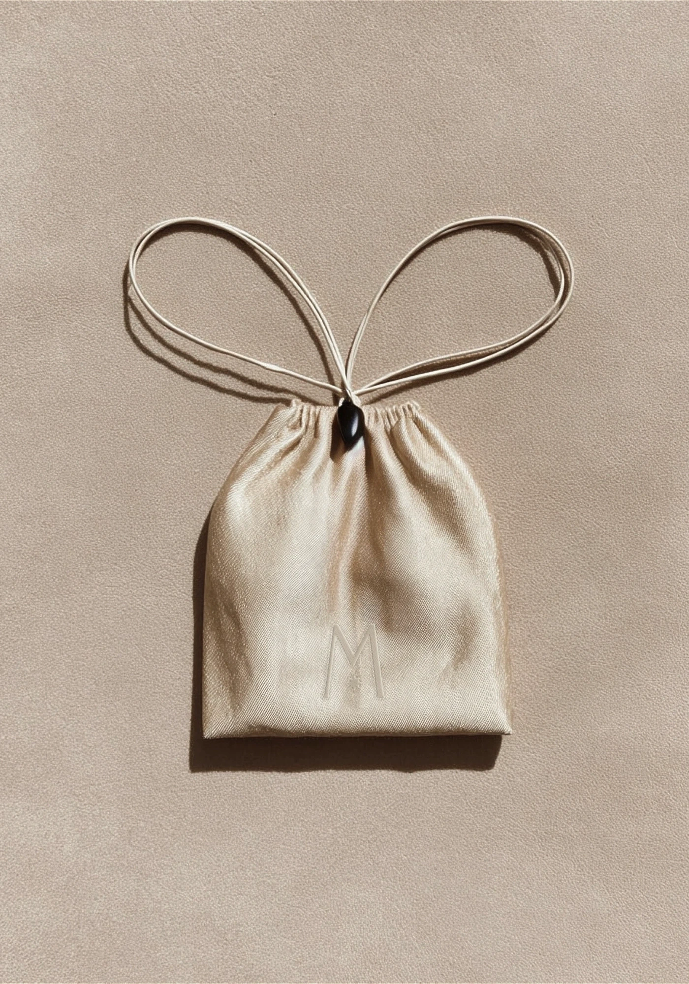 Luxury packaging system for a jewelry brand including bags, tissue and cases