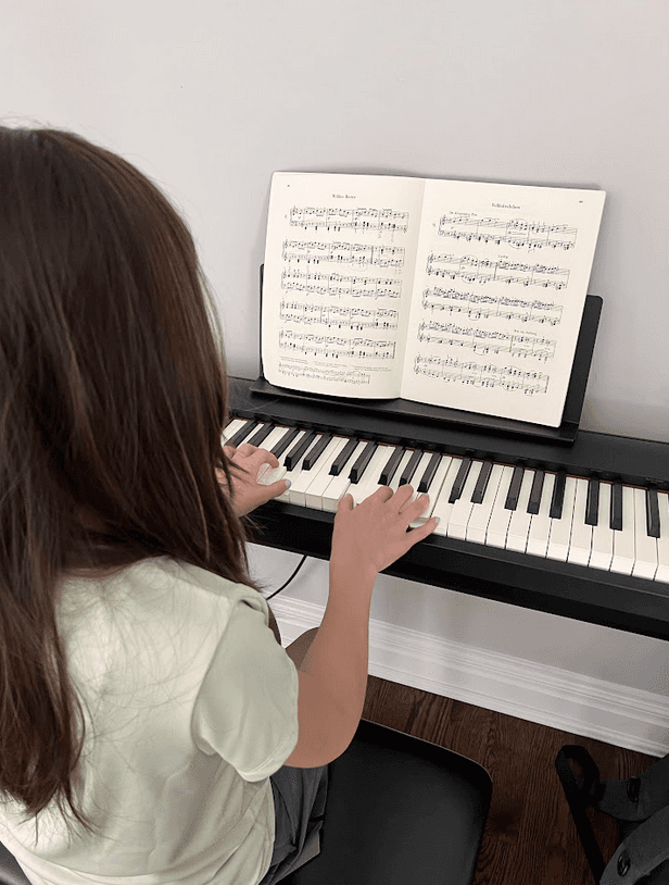 student learning piano