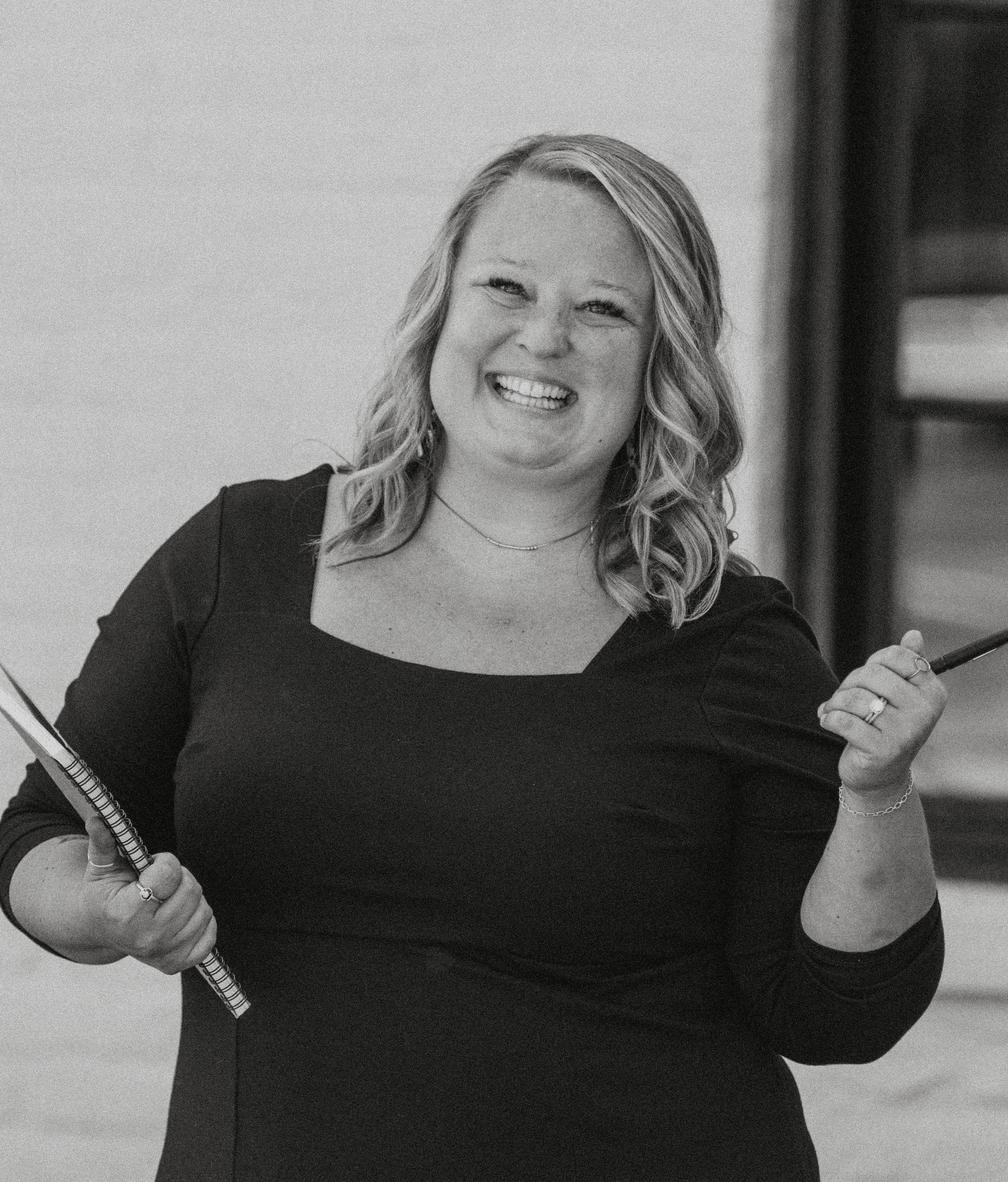 A mother and her daughter are working together on a laptop, focusing on homework