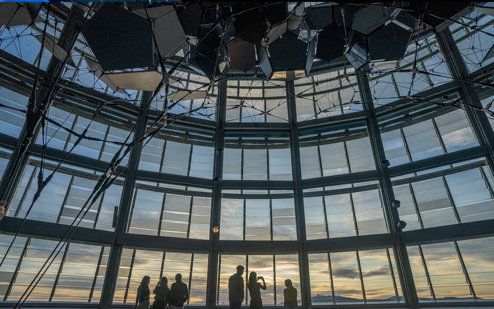Visitors enjoying sunset views from Torre Glories Lookout in Barcelona.