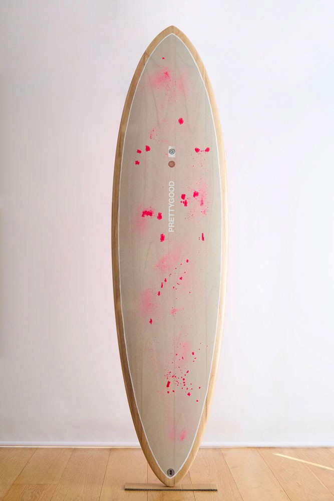 Grey painted wooden surfboard