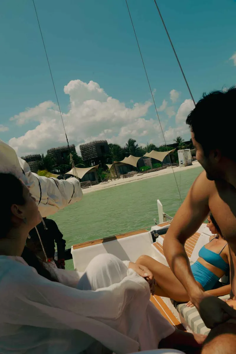 Guest relaxing on the beach, soaking up the sun and enjoying the ocean views at Nomade Holbox in Tulum Mexico
