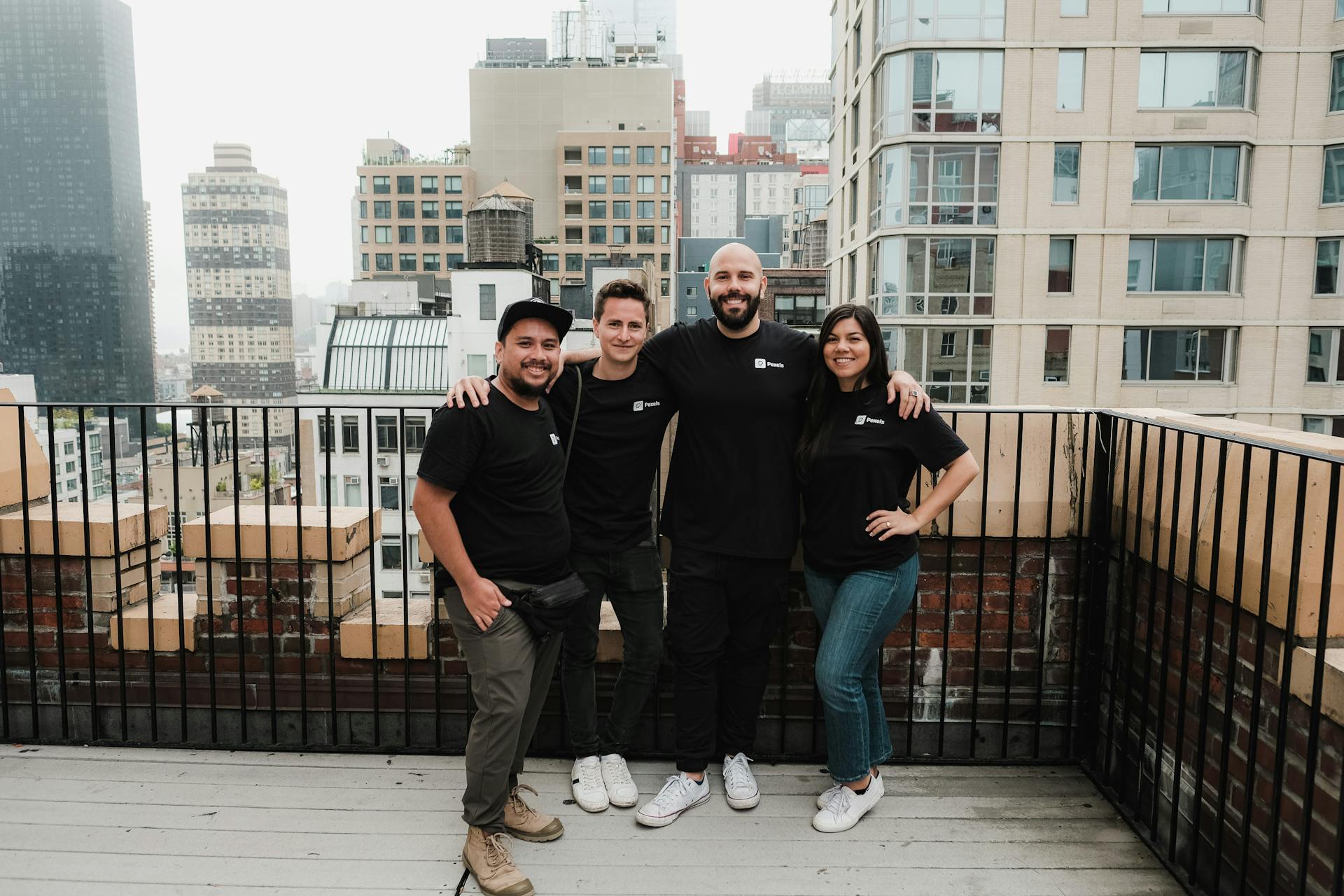 A group of four gathered for a shot at the rooftop