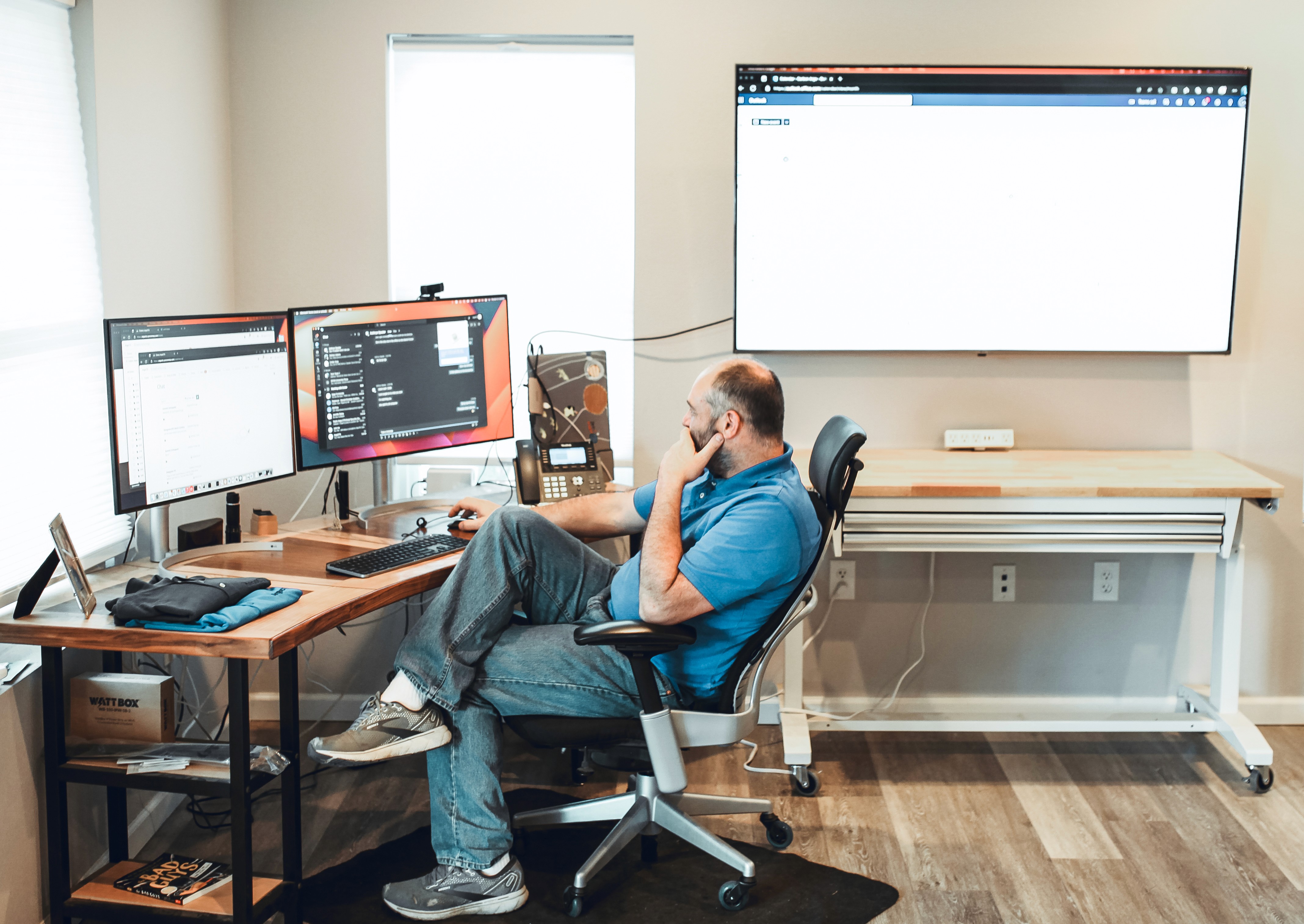 people sitting on chair in front of laptop computers