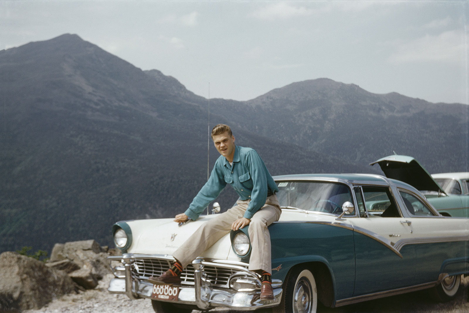 Man sitting on a car