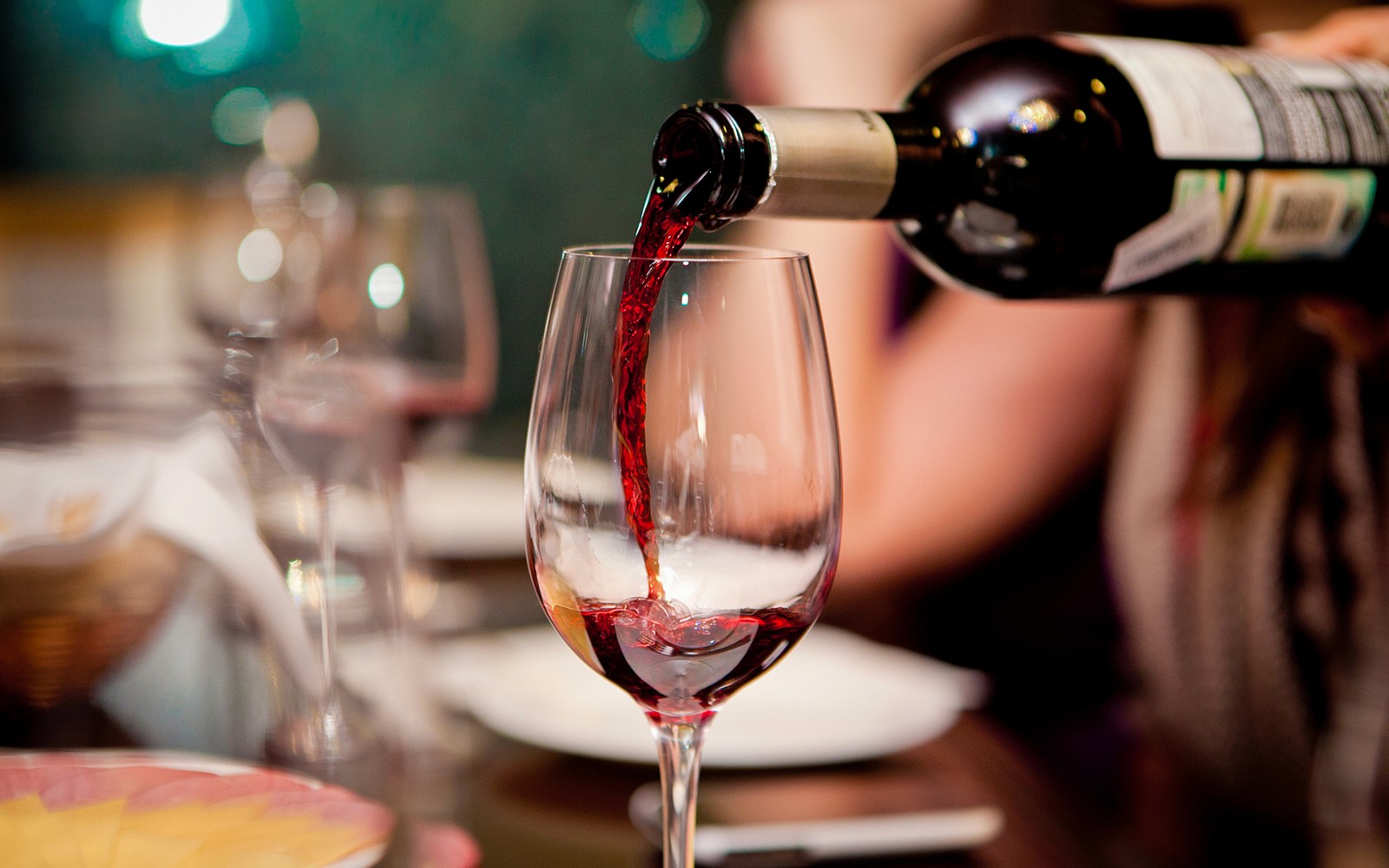 Wine glasses on a table in a Parisian restaurant.