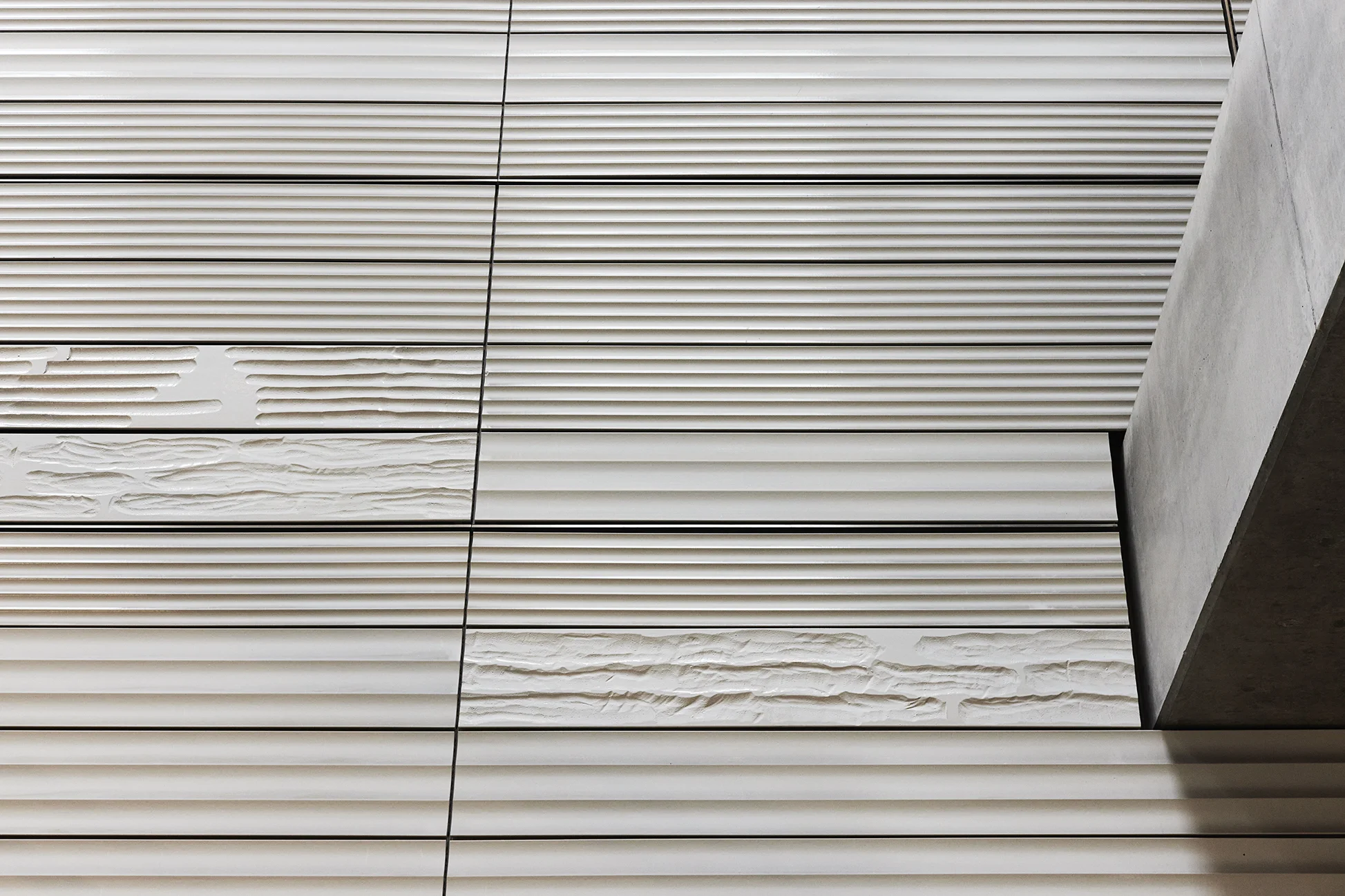 Installation photograph of the public commission work installed at Enghave Brygge Metro, Copenhagen. Ceramic wall panels with handcrafted relief.