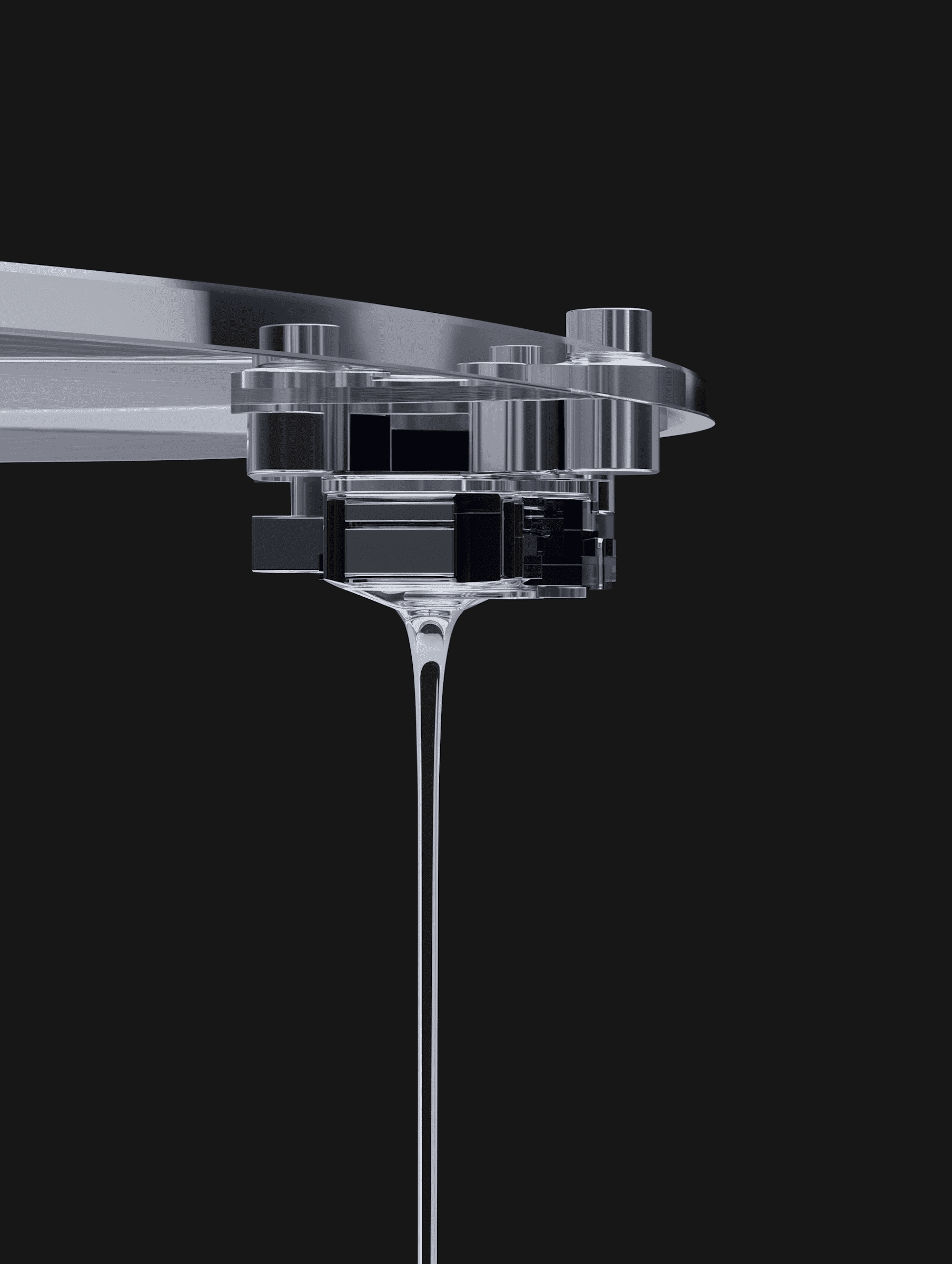 Transparent liquid pouring from a thin glass spout into a dark container