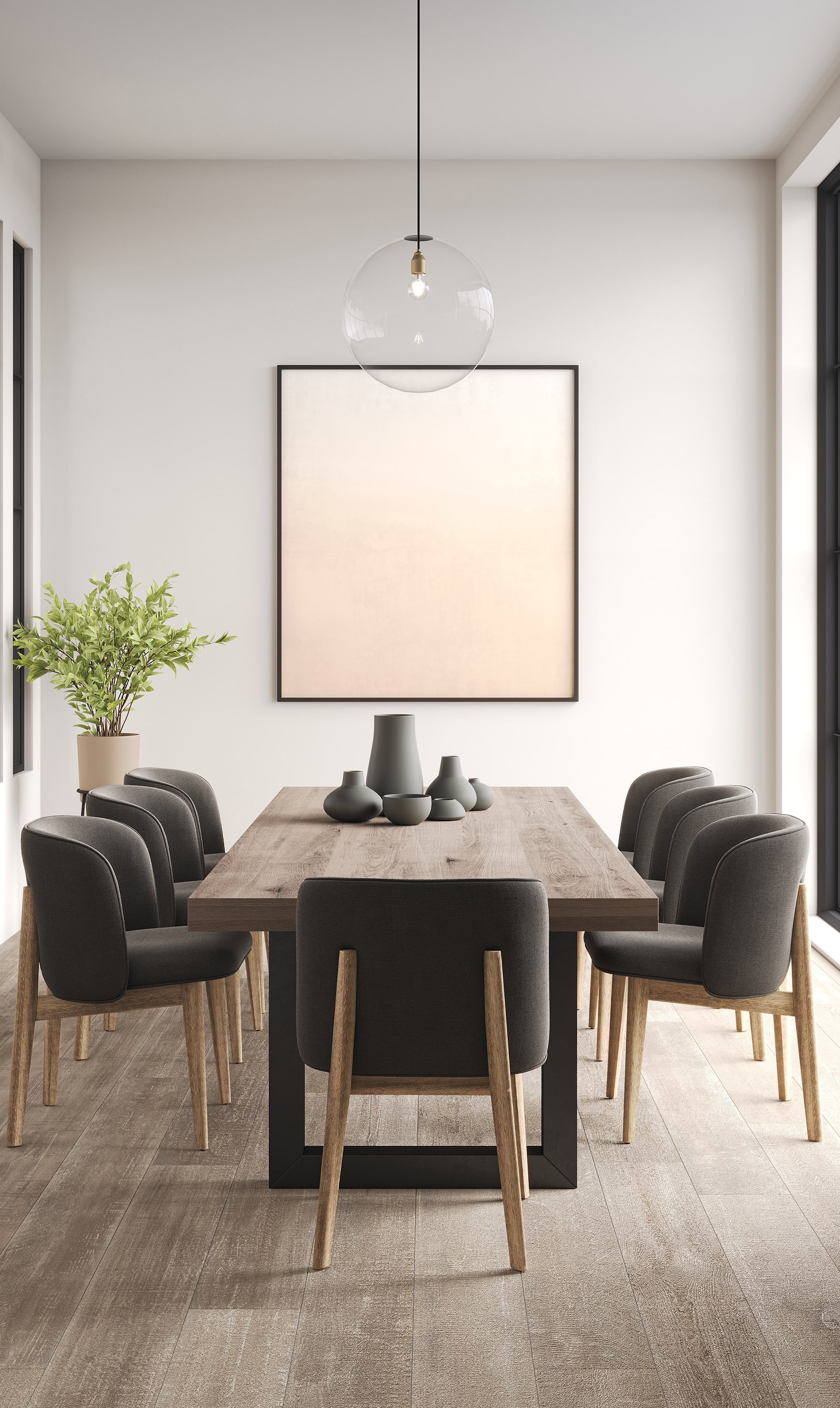 Modern dining room with wooden table, upholstered chairs, and pendant lighting