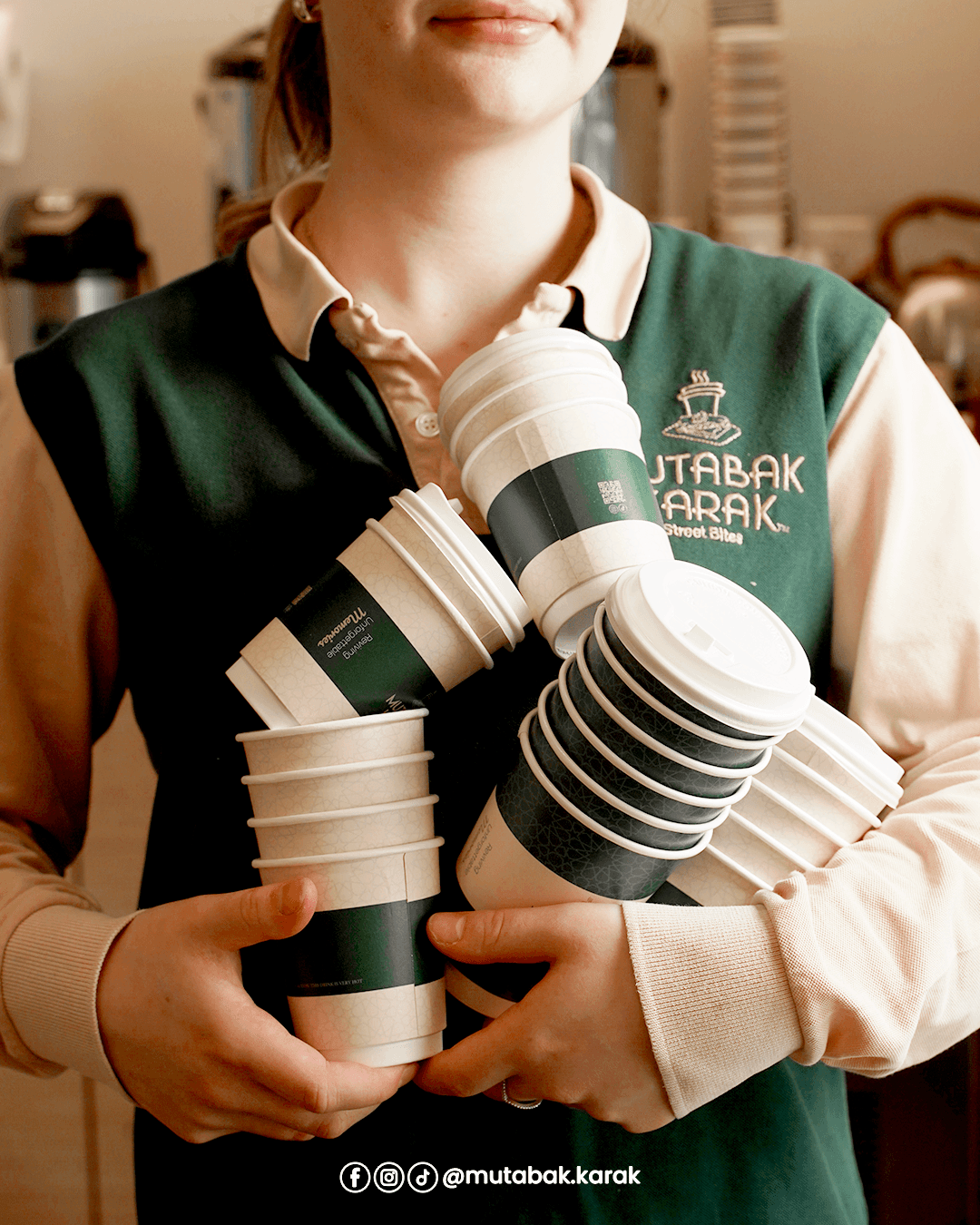 Layered latte in glass with flowers and plants