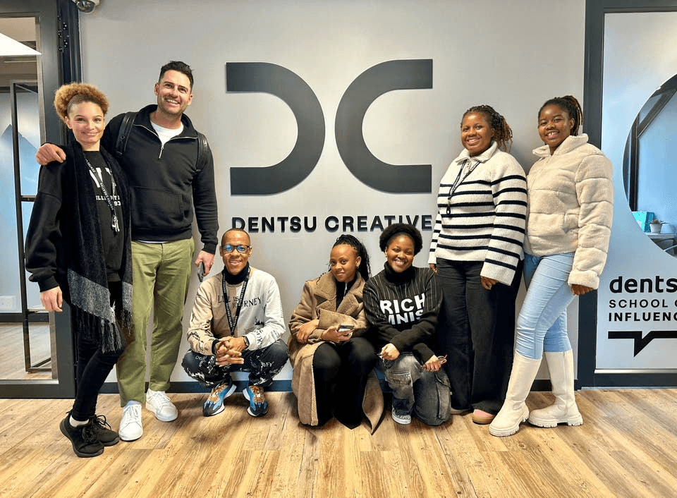 2025 Dentsu School of Influence cohort standing in the Dentsu Creative Offices with Greg Bailie from TikTok