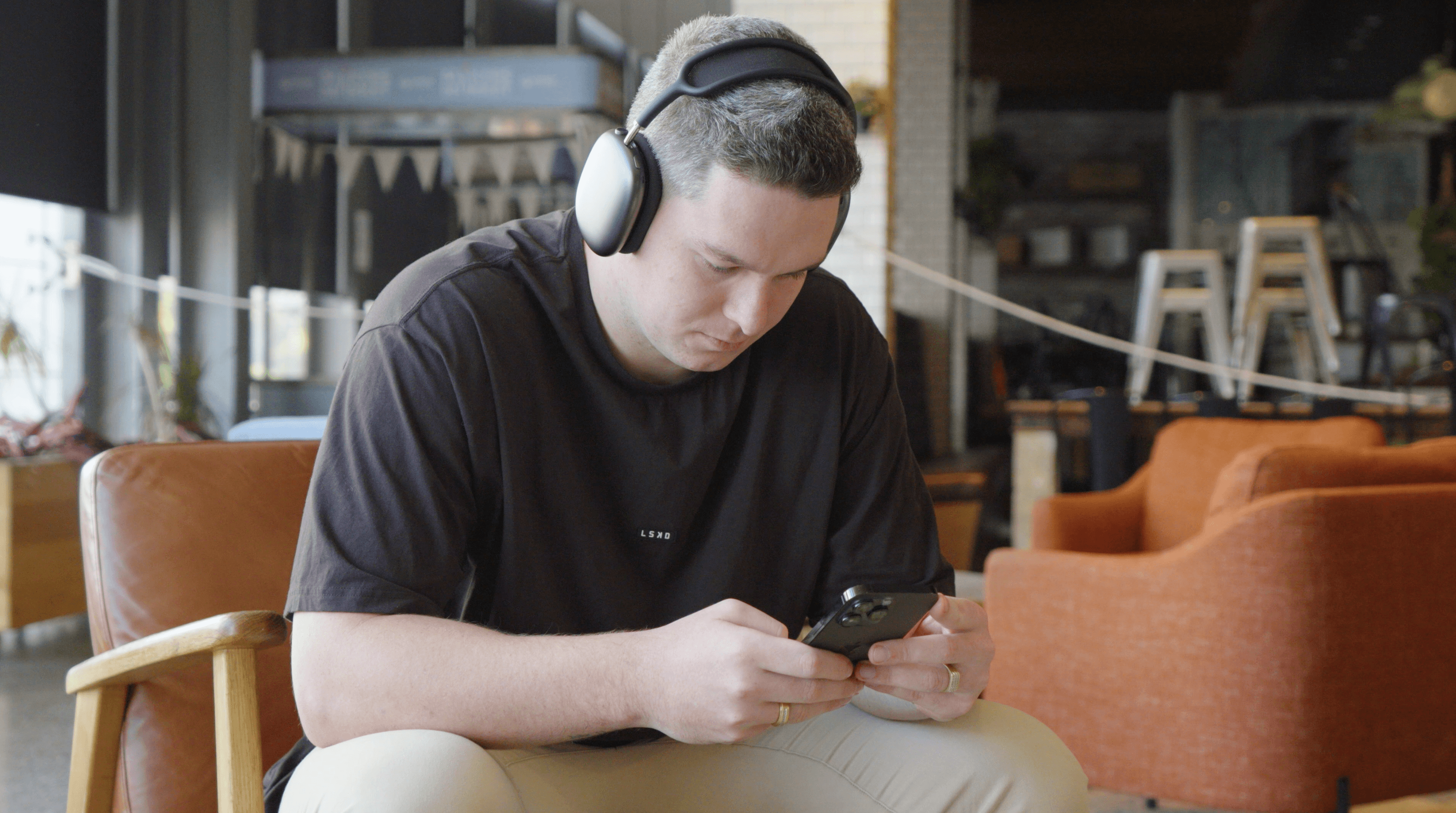 Image of Jacob Sutton on ithe phone