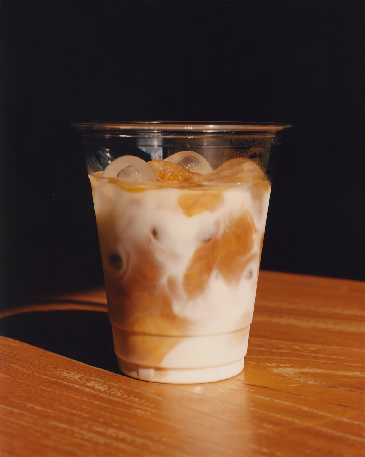 A cold NKORA coffee cup