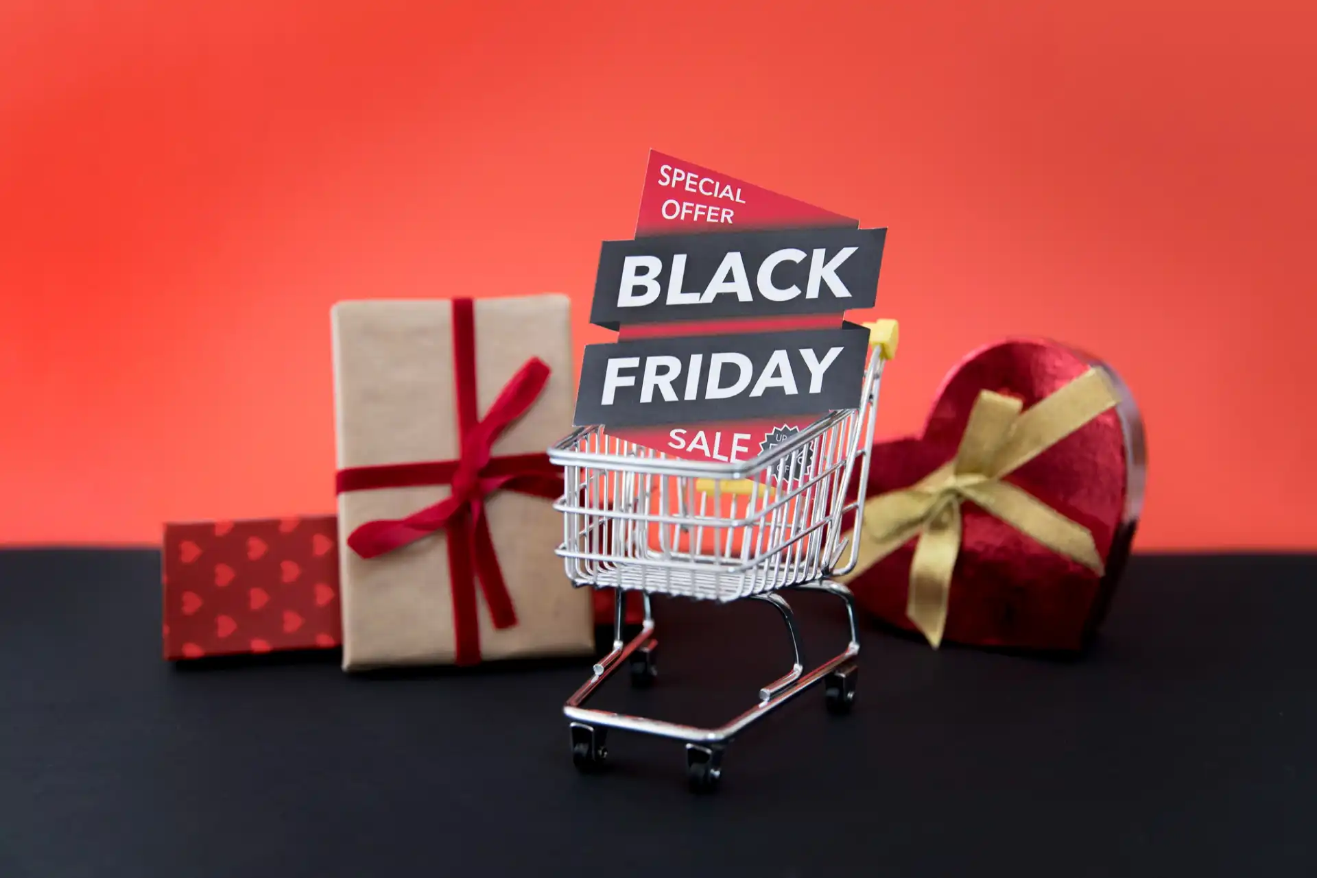 A miniature shopping cart with a Black Friday sign represents holiday gift shopping on TikTok Shop.