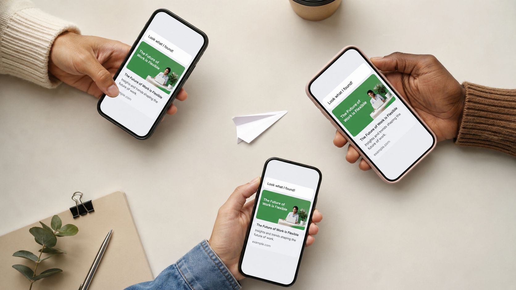 Three hands holding smartphones displaying digital articles about the future of work on a white desk.