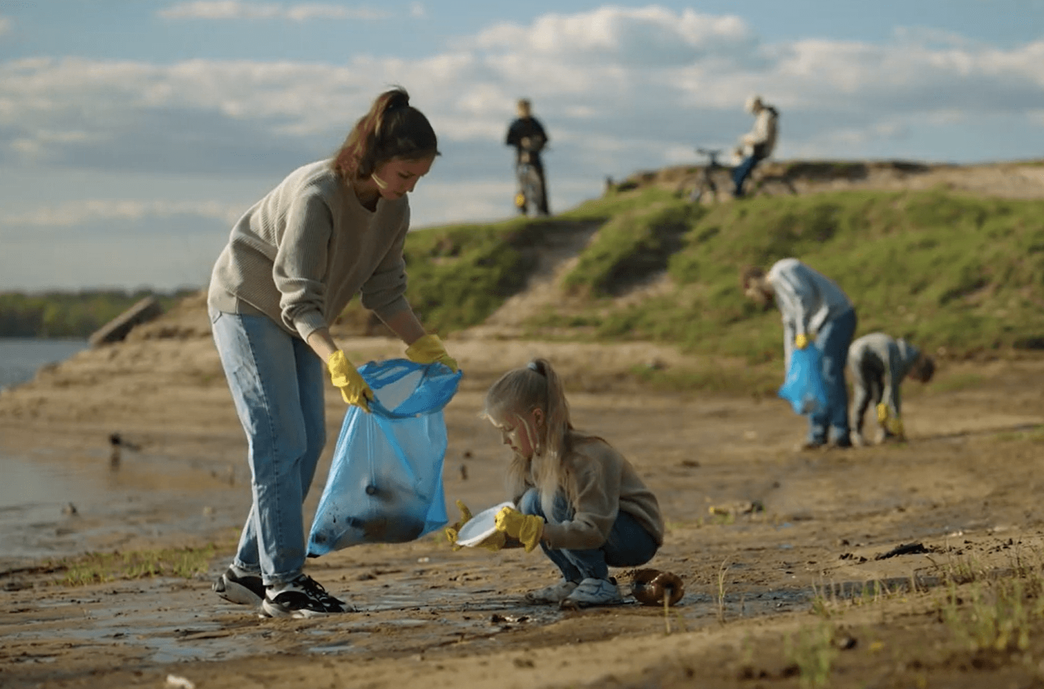 Altruism in action - people cleaning up a beach