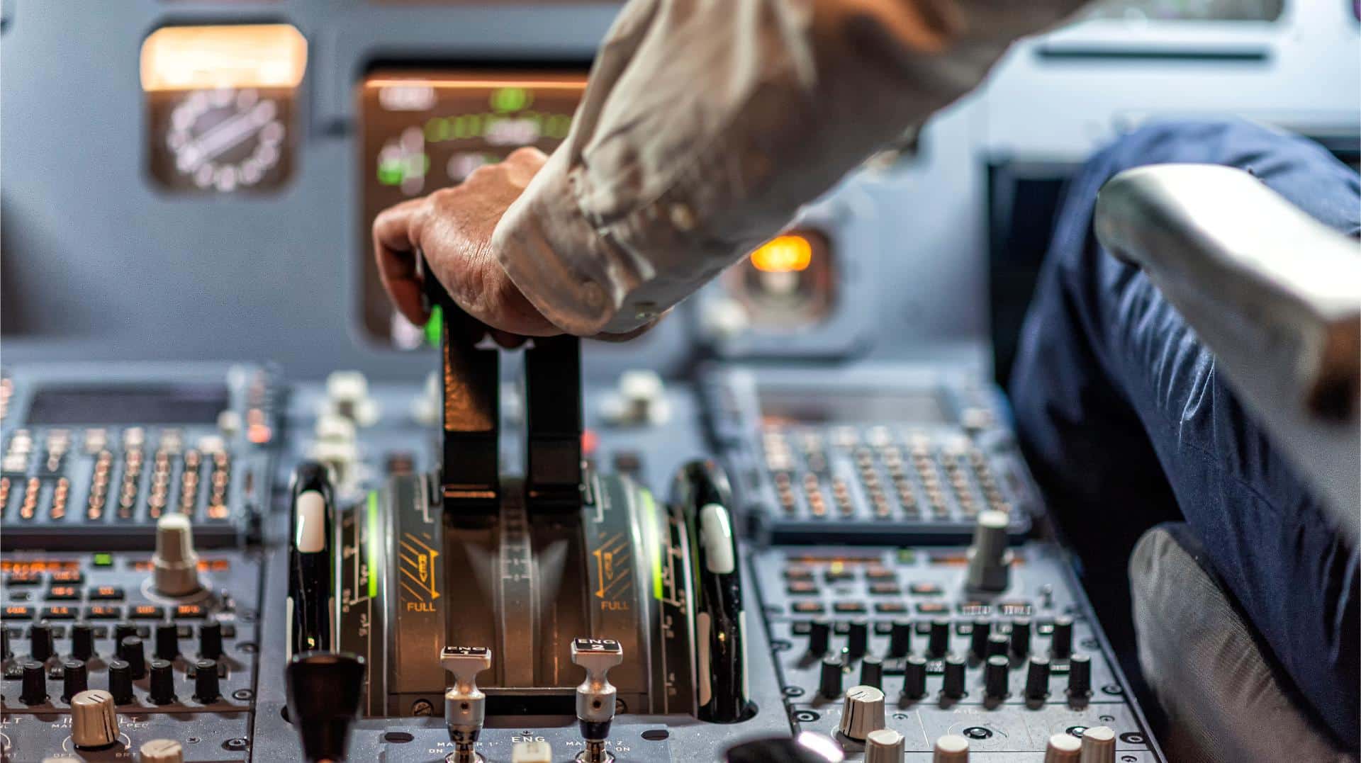 pilots in a cockpit in an airplane
