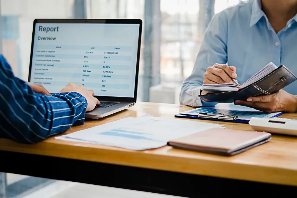Healthcare administrator reviewing addiction treatment reporting software analytics