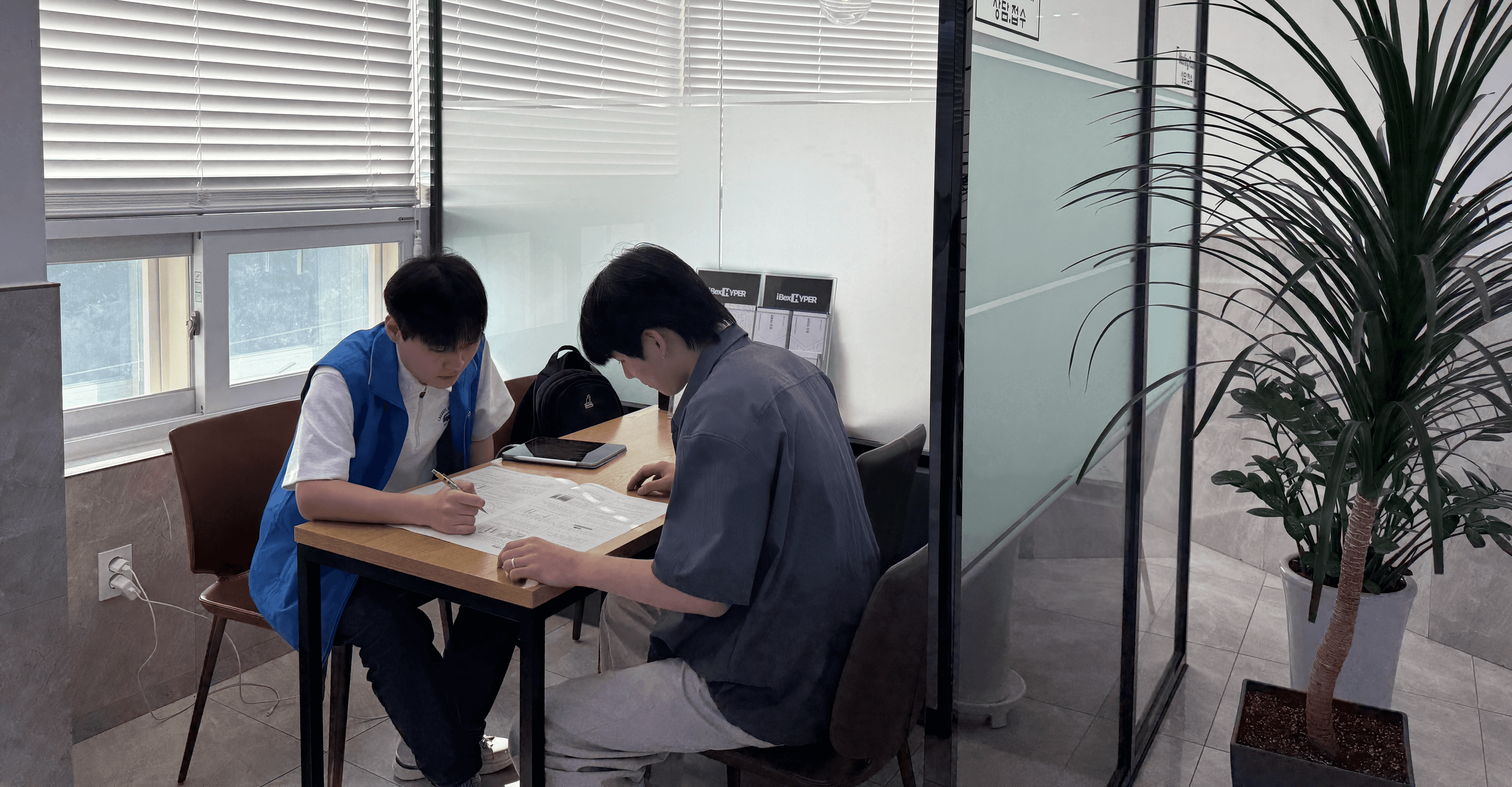 A man is walking in the middle of the street.