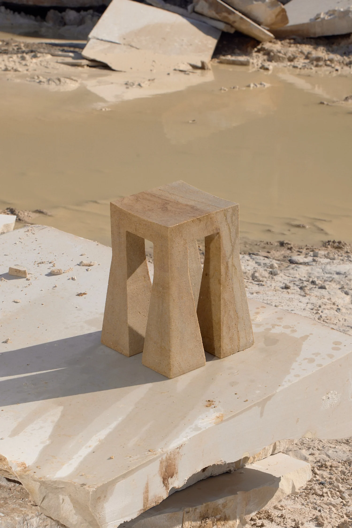Sand Lada stool in natural quartz sandstone with transparent finish by Jiri Krejcirik