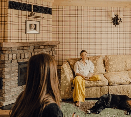 Two woman sitting in the room