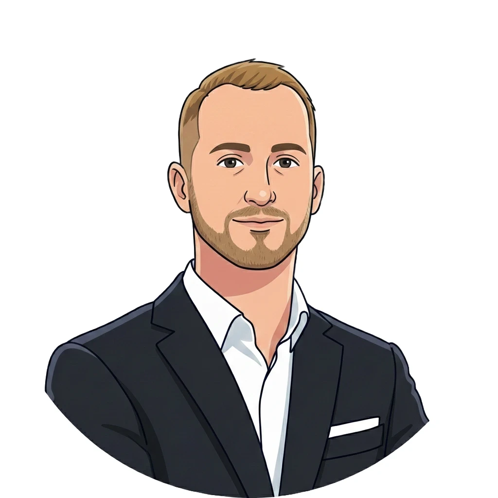 Smiling woman with glasses working on a laptop at a wooden desk, with a pink coffee mug beside her