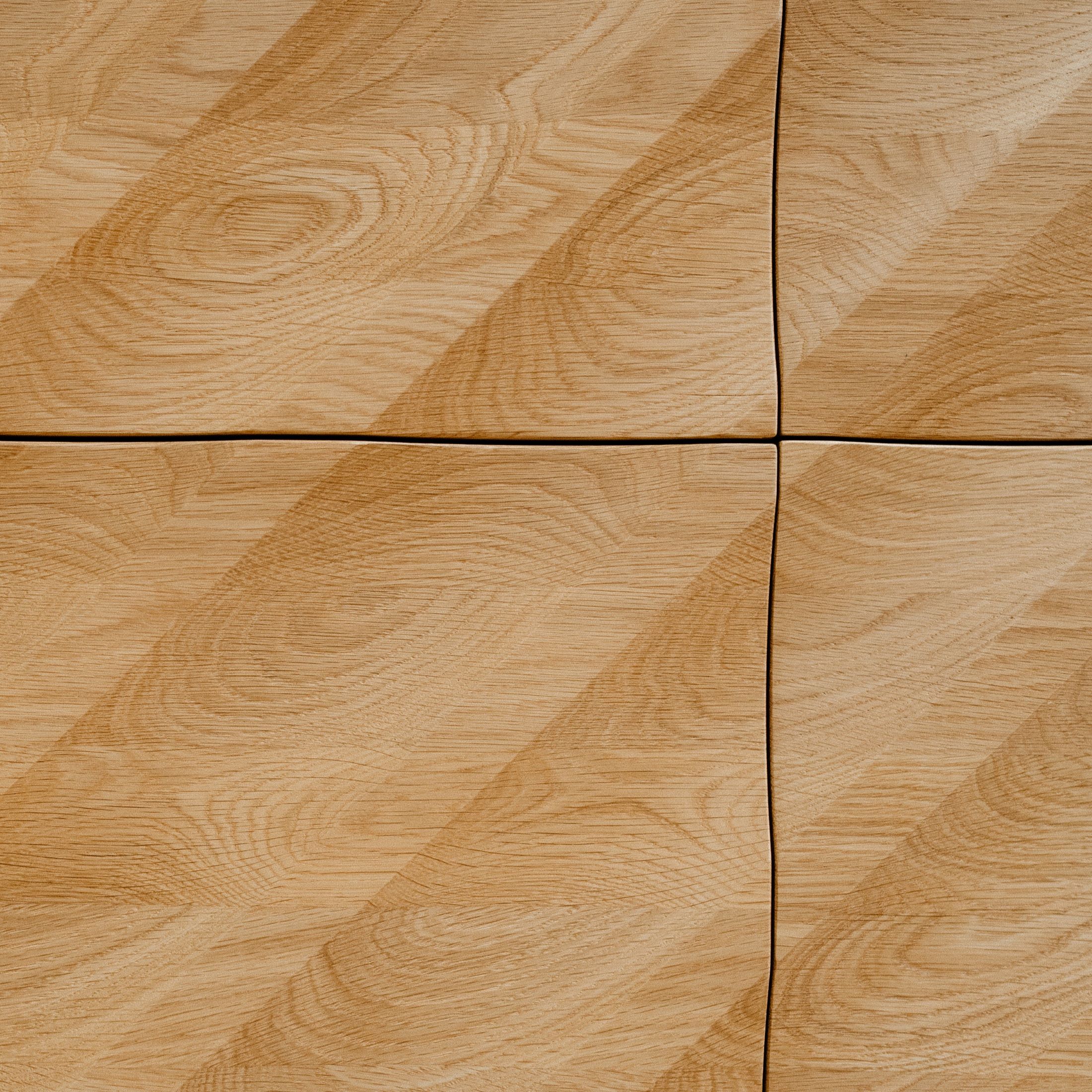 A fast black sports car races down the highway.