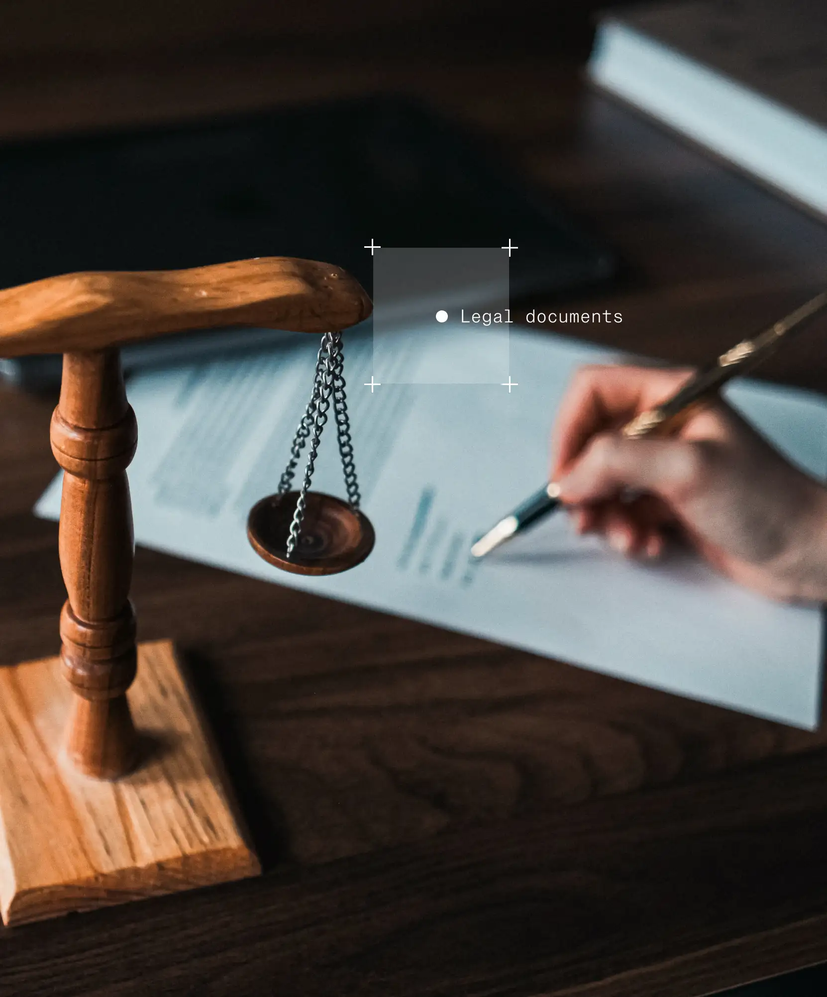 Image of hand reviewing legal documents