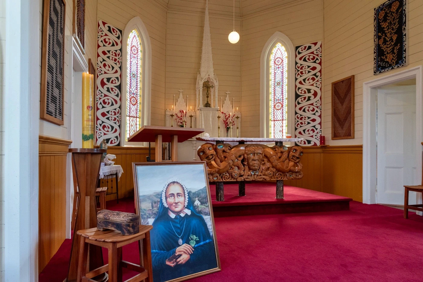Church interior with portrait near altar