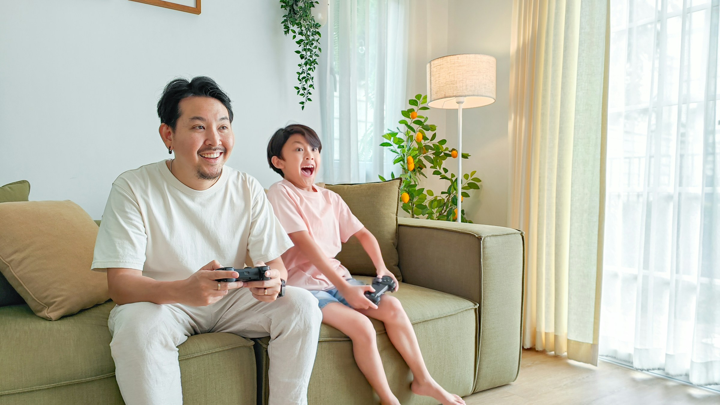 person playing game with his son - Best Posture for Gaming