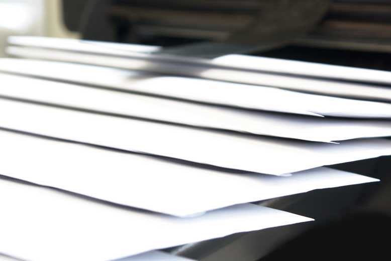 A horizontal stacked arrangement of envelopes.