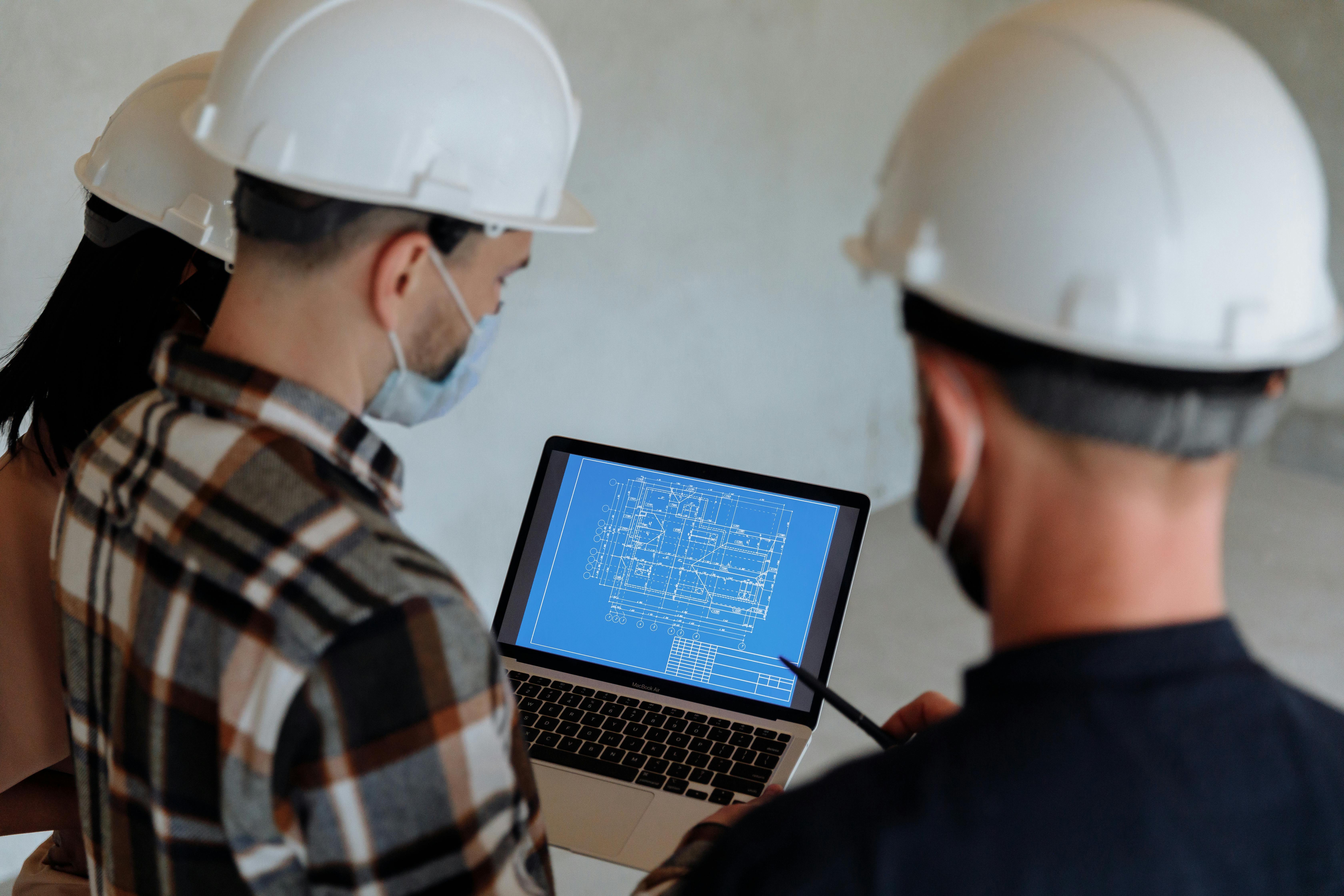 two men working on the roof of a house